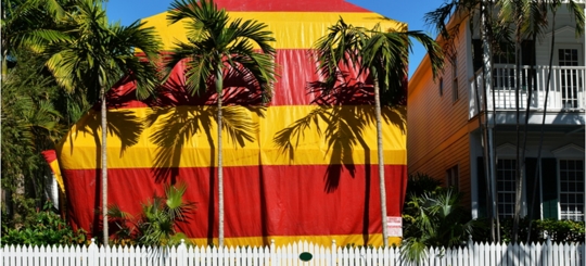 A building covered by a tent, likely a fumigation