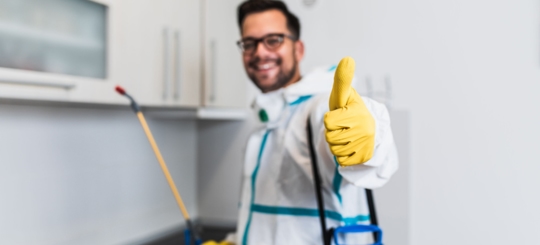 A picture of a guy smiling with his thumbs up