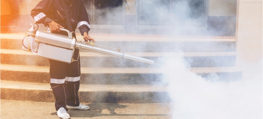 A person is doing a spray treatment service