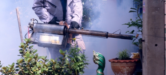 A person is doing a pest control service